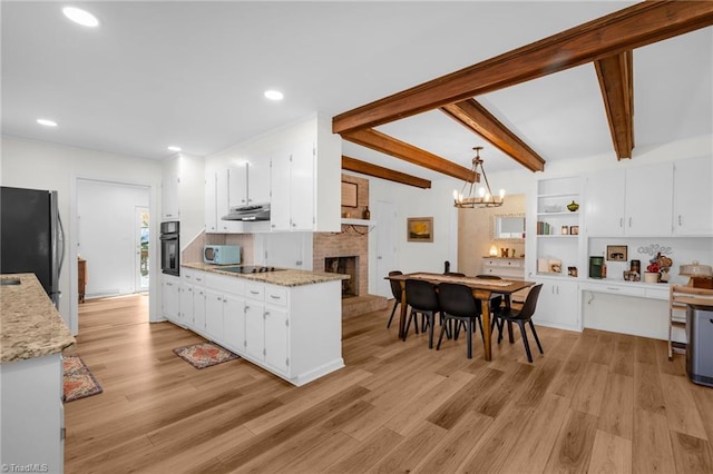 kitchen with open shelves, a fireplace, white cabinets, black appliances, and light wood-style flooring