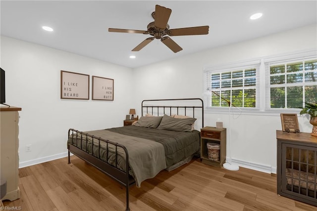 bedroom featuring recessed lighting, baseboards, and wood finished floors