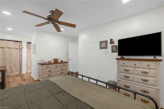 bedroom with baseboards, a ceiling fan, recessed lighting, and wood finished floors