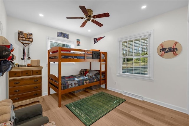 bedroom with visible vents, recessed lighting, baseboards, and wood finished floors