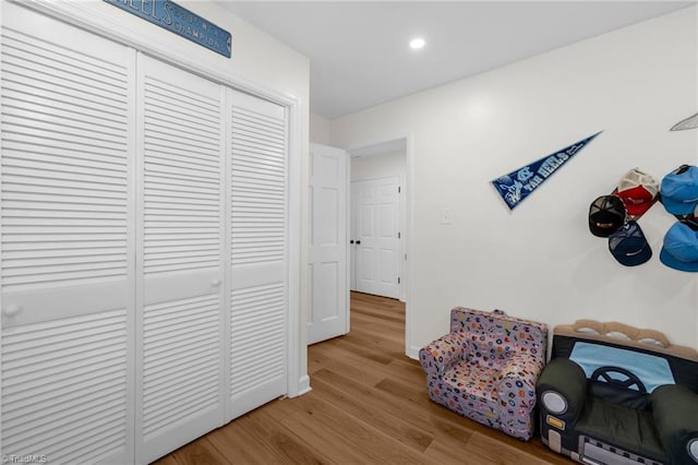 sitting room featuring baseboards and wood finished floors