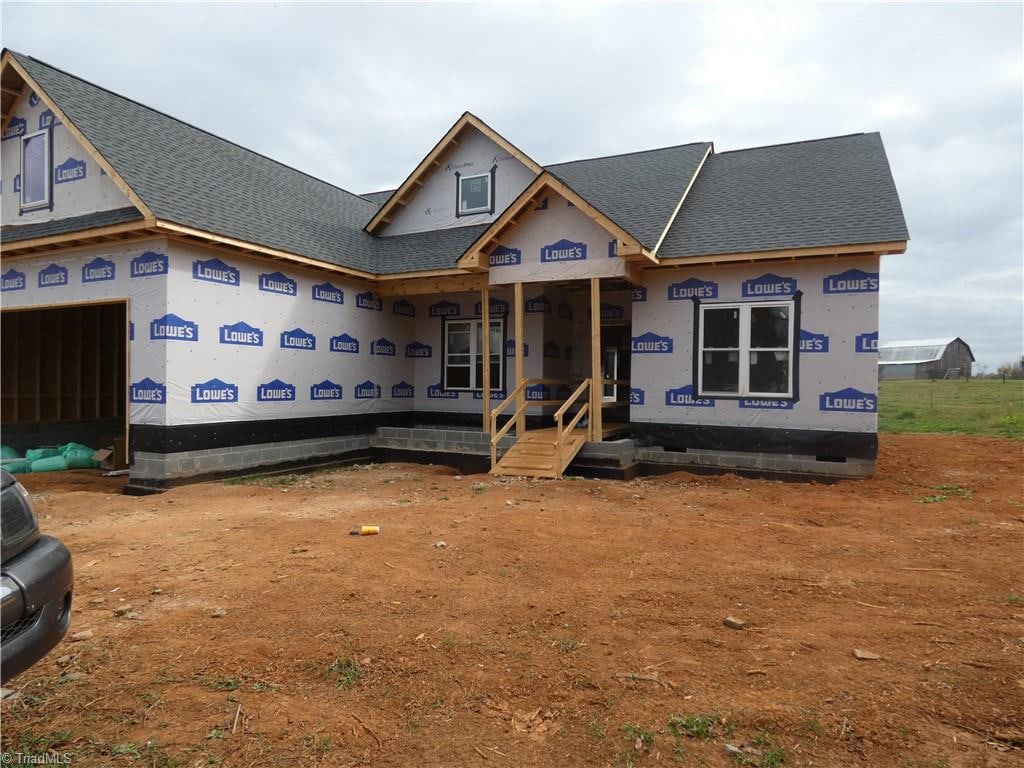 property in mid-construction featuring covered porch