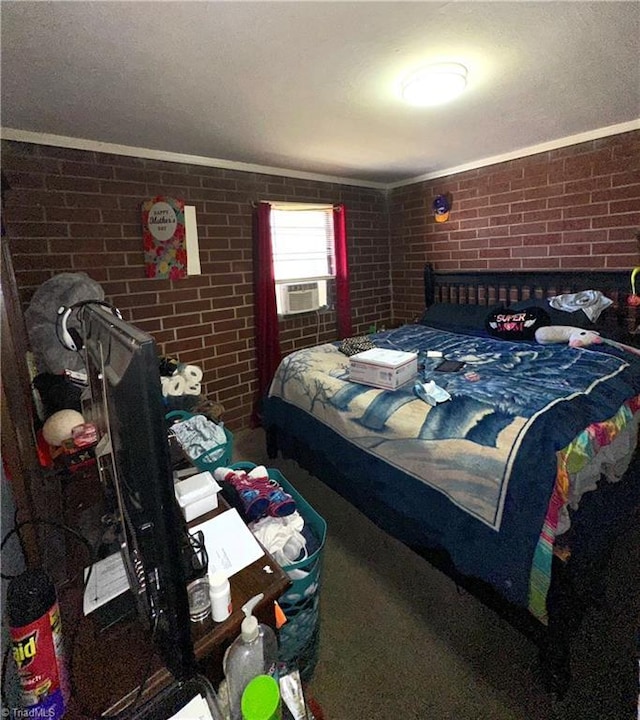 bedroom with cooling unit and brick wall