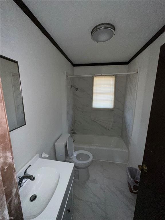 full bathroom with washtub / shower combination, vanity, toilet, and crown molding