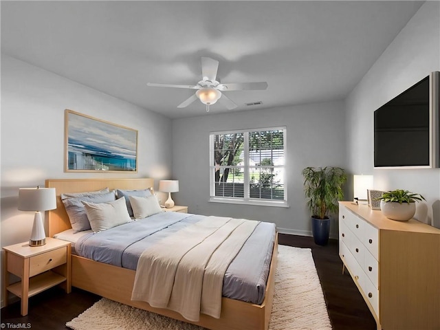 615 Walnut Crossing Dr, Whitsett, NC 27377 - bedroom featuring dark wood-style floors, baseboards, and ceiling fan