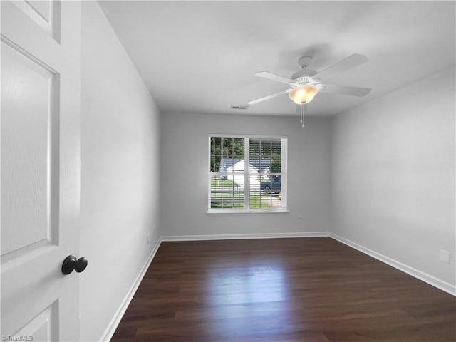 615 Walnut Crossing Dr, Whitsett, NC 27377 - spare room with wood finished floors, ceiling fan, and baseboards