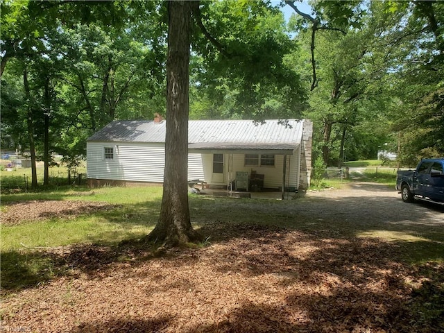 291 Virgil Hill Rd, Asheboro, NC 27205 - rear view of house with metal roof and a chimney
