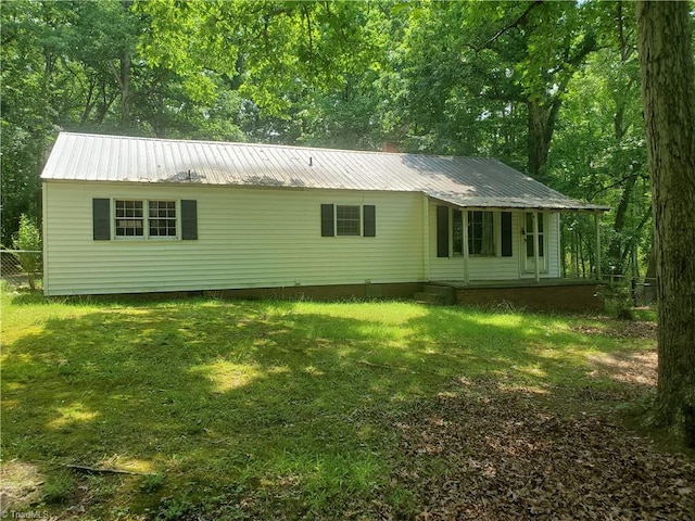 291 Virgil Hill Rd, Asheboro, NC 27205 - rear view of property featuring metal roof, crawl space, and a porch