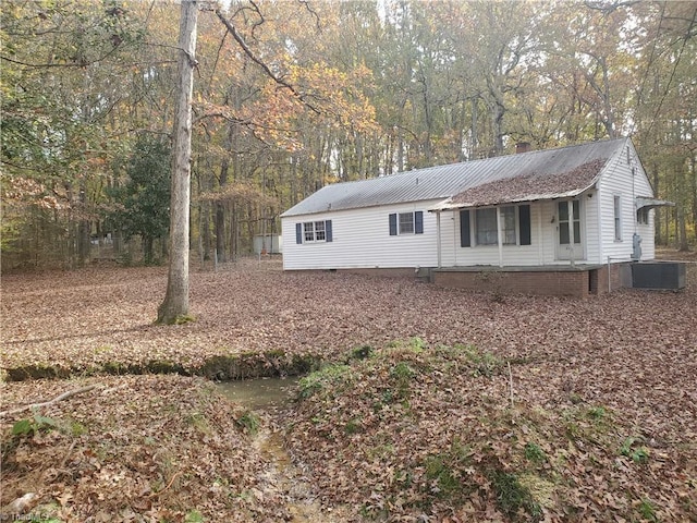 exterior space featuring central AC unit