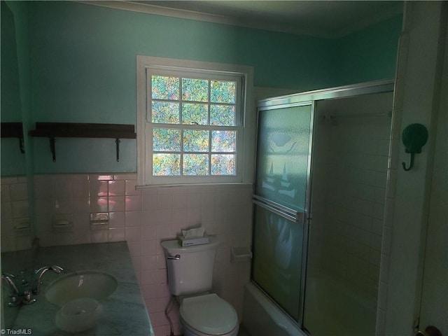 291 Virgil Hill Rd, Asheboro, NC 27205 - bathroom featuring toilet, tile walls, vanity, and shower / bath combination with glass door
