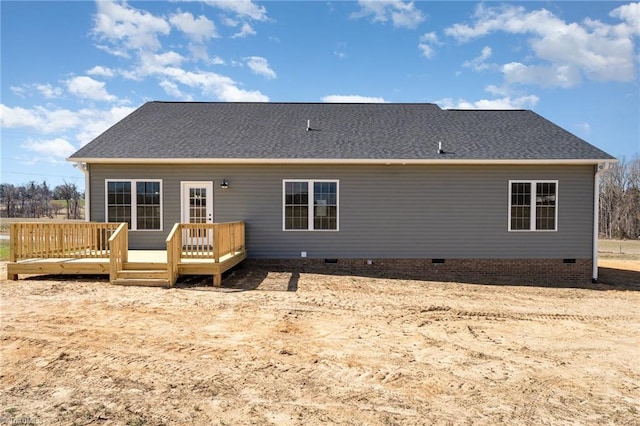 rear view of house featuring a shingled roof, crawl space, and a wooden deck