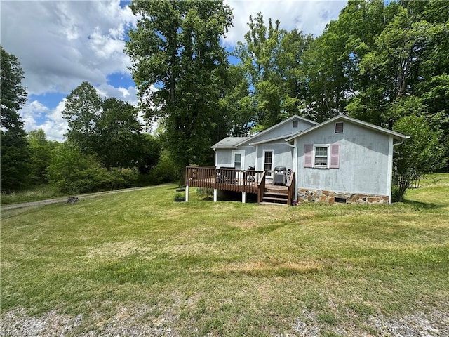 4679 S NC Highway 18, Moravian Falls, NC 28654 - rear view of property featuring a deck, a lawn, and view of wooded area
