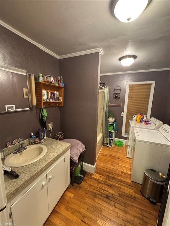 4679 S NC Highway 18, Moravian Falls, NC 28654 - full bath with independent washer and dryer, crown molding, wood-type flooring, vanity, and shower / bathtub combination with curtain