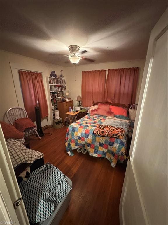 4679 S NC Highway 18, Moravian Falls, NC 28654 - bedroom with wood finished floors and a ceiling fan