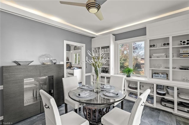 dining room featuring ceiling fan