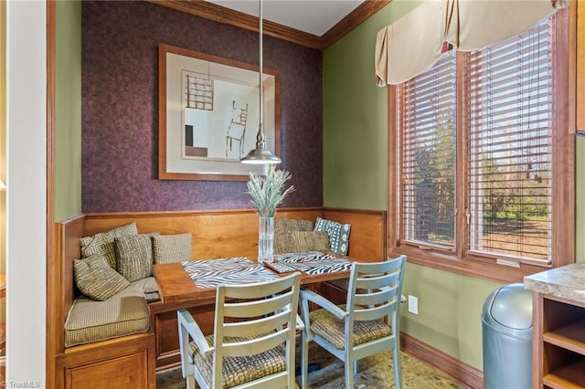 dining area featuring breakfast area and ornamental molding