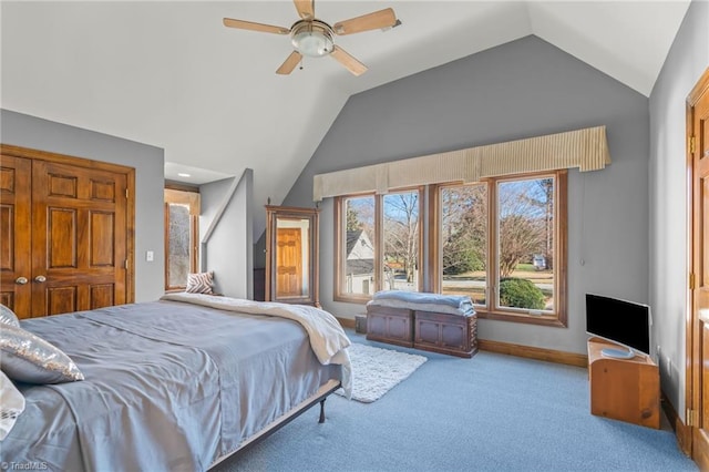 carpeted bedroom with vaulted ceiling and ceiling fan