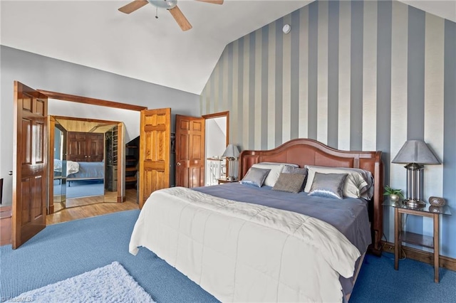 bedroom with ceiling fan, carpet floors, and lofted ceiling