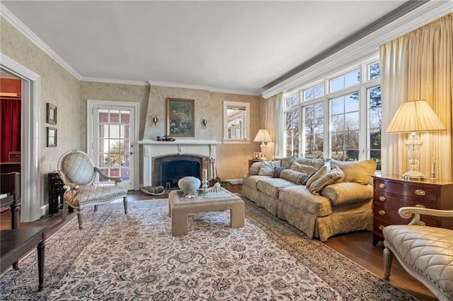 living room featuring hardwood / wood-style flooring, plenty of natural light, and ornamental molding