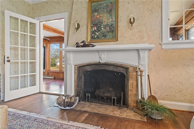 details with hardwood / wood-style flooring and a baseboard radiator