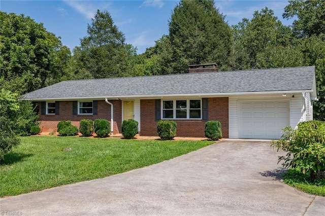 ranch-style house with a garage and a front lawn