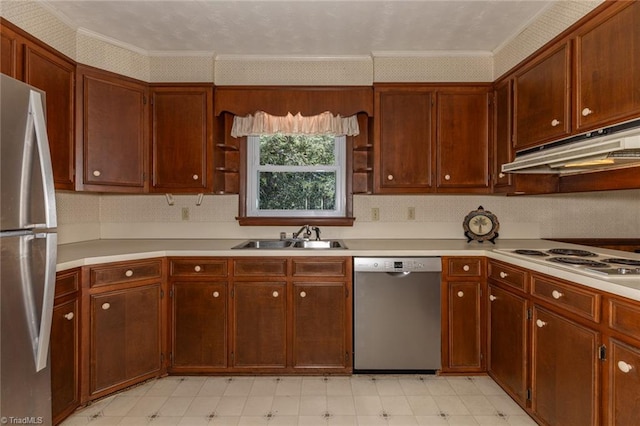 kitchen featuring light tile patterned flooring, appliances with stainless steel finishes, crown molding, and sink