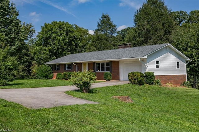 single story home with a garage and a front yard