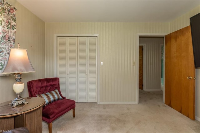 living area with light colored carpet