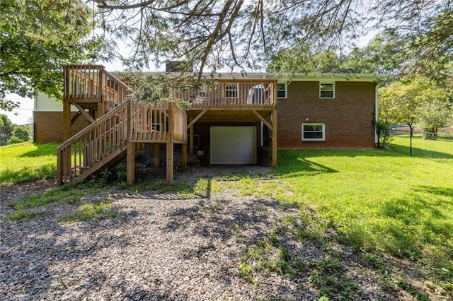 back of property featuring a garage and a lawn