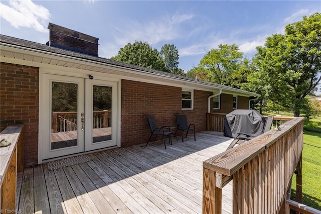 wooden deck featuring grilling area