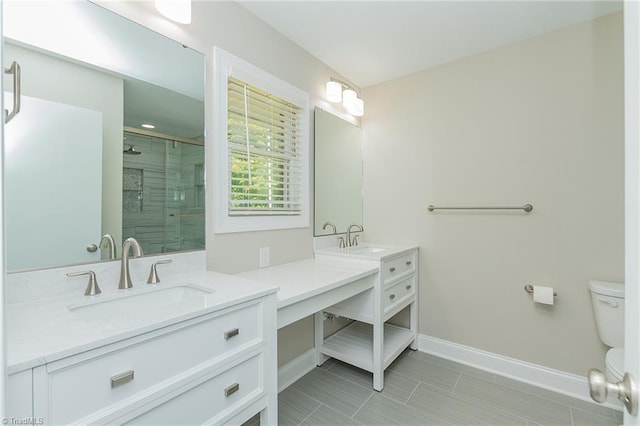 bathroom featuring walk in shower, tile patterned floors, vanity, and toilet