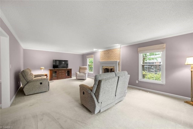 carpeted living room featuring crown molding, a textured ceiling, a fireplace, and baseboards