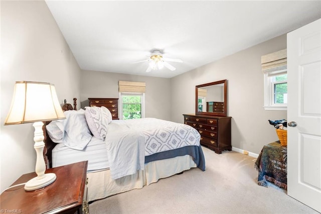 bedroom featuring carpet floors, baseboards, and a ceiling fan