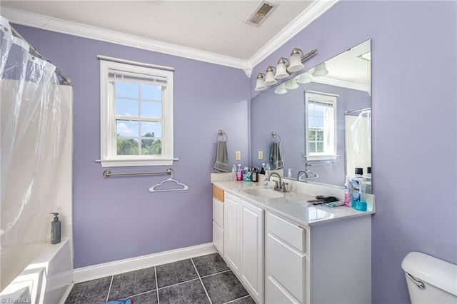 bathroom featuring vanity, tile patterned flooring, ornamental molding, and toilet