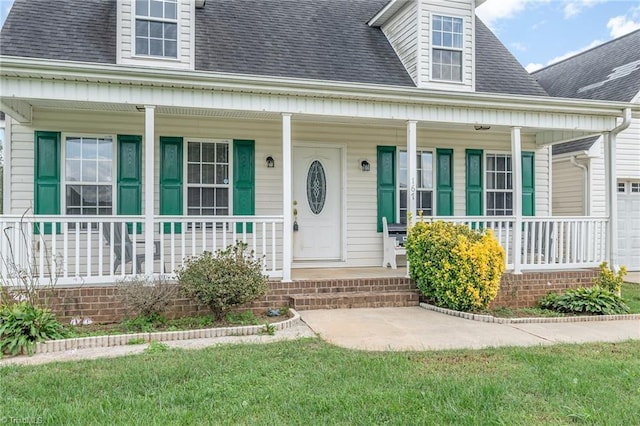 property entrance featuring a porch and a garage