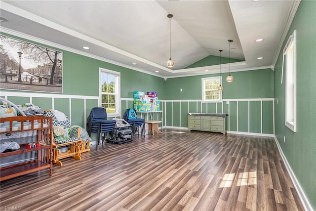 recreation room with crown molding, vaulted ceiling, and hardwood / wood-style floors