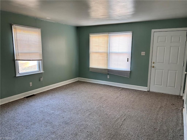 spare room featuring carpet floors