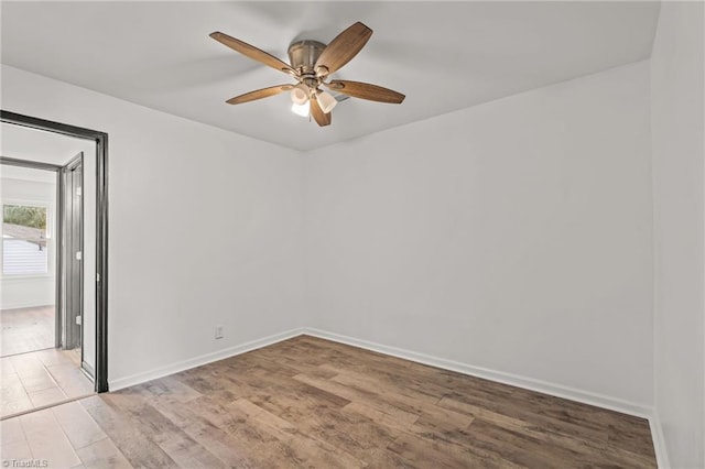 spare room with light hardwood / wood-style floors and ceiling fan