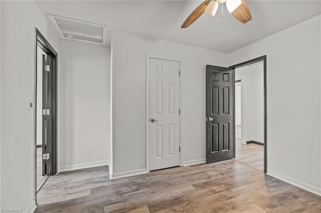 unfurnished bedroom featuring ceiling fan and light hardwood / wood-style flooring