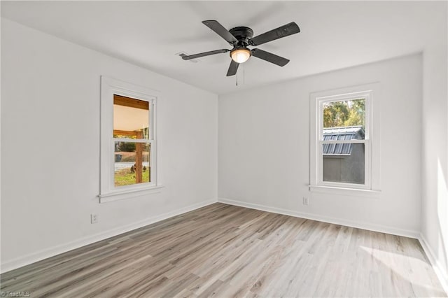 empty room with ceiling fan and light wood-type flooring