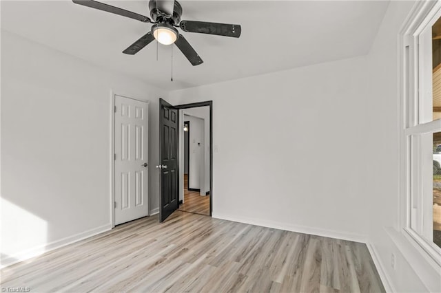 unfurnished room featuring ceiling fan and light hardwood / wood-style floors