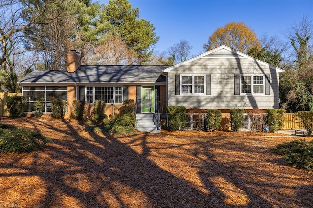 view of front of property with a sunroom