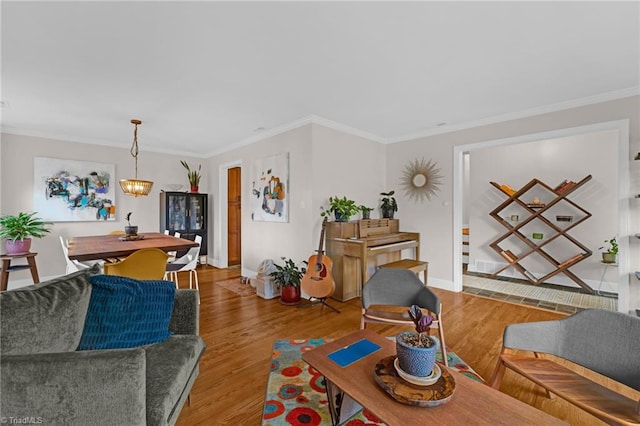 living room featuring light hardwood / wood-style floors and ornamental molding