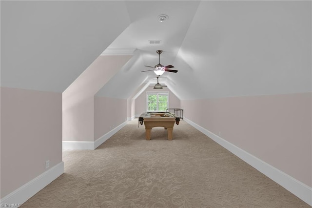 rec room featuring visible vents, baseboards, carpet floors, and vaulted ceiling