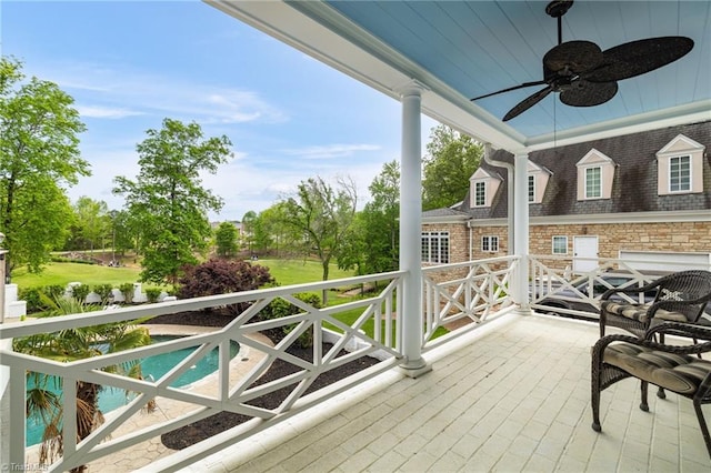 exterior space featuring a ceiling fan