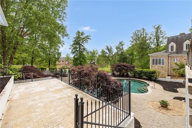 view of pool with a patio, fence, and a fenced in pool