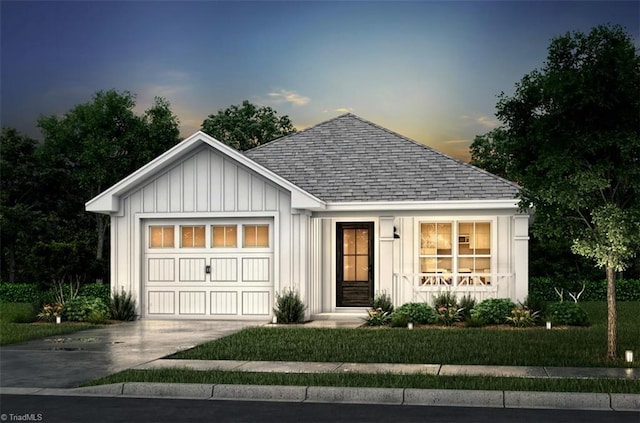 1181 Flora Ave, Burlington, NC 27217 - view of front of property with an attached garage, roof with shingles, concrete driveway, and board and batten siding
