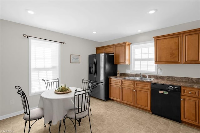 kitchen with sink and black appliances