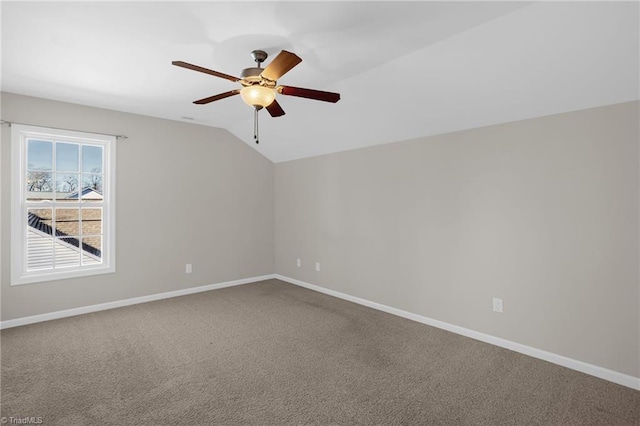 spare room with lofted ceiling, carpet flooring, and ceiling fan