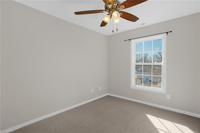 unfurnished room with ceiling fan and carpet flooring